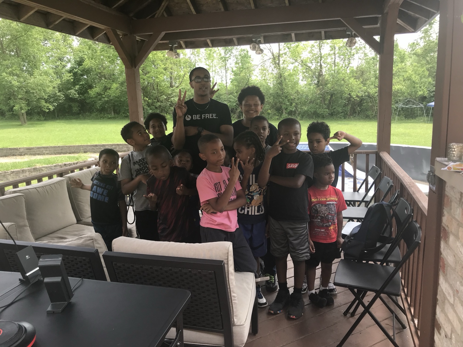 DeMarco Cannon with youth at an outdoor event